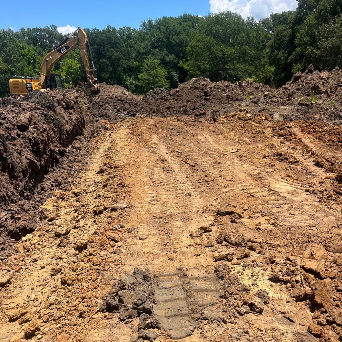 Excavator shown expanding lake and building dam in Paris, Texas